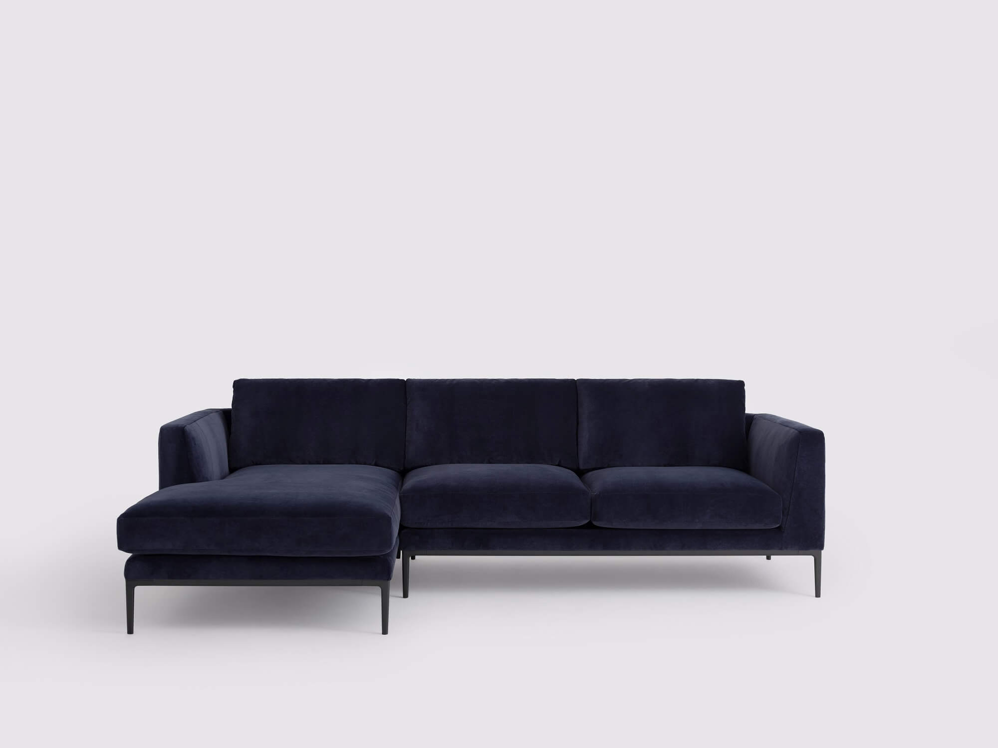 Front view of the Oma modern sectional couch in blue velvet with left hand chaise